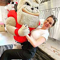 Stephanie dancing with UGA mascot Hairy Dawg